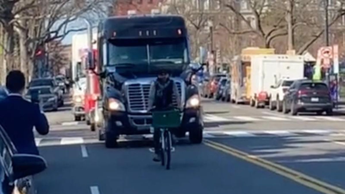 WATCH: Lone bicyclist brings DC trucker convoy to a standstill as trucks honk in rage
