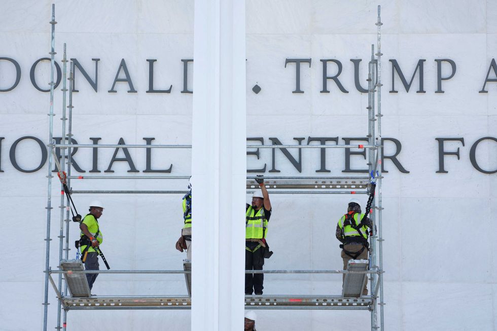 Workers remove Trump's name from Kennedy Center following court order