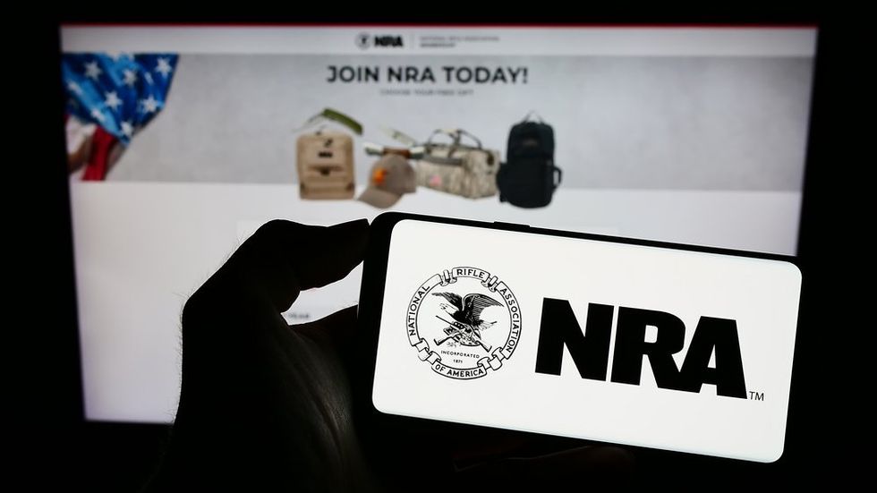 Furious ex-NRA president accused of hurling water at attorney during deposition