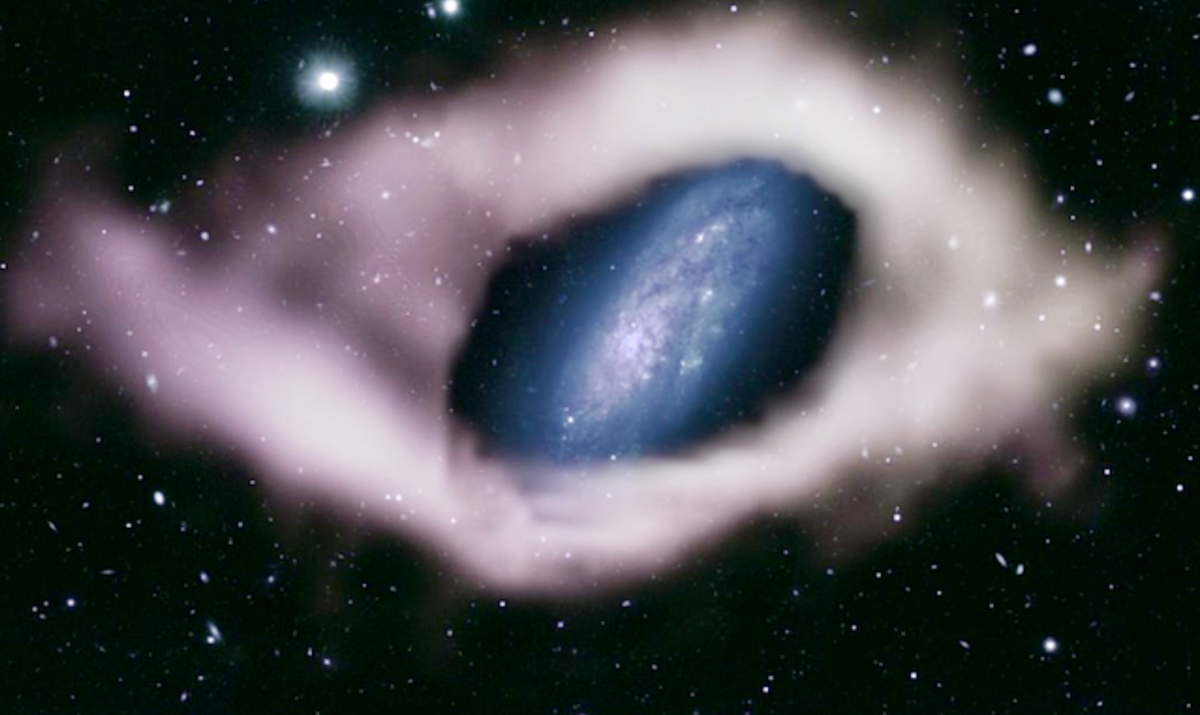 Astronomers have discovered a rare ‘polar ring galaxy’ wrapped in a huge ribbon of hydrogen