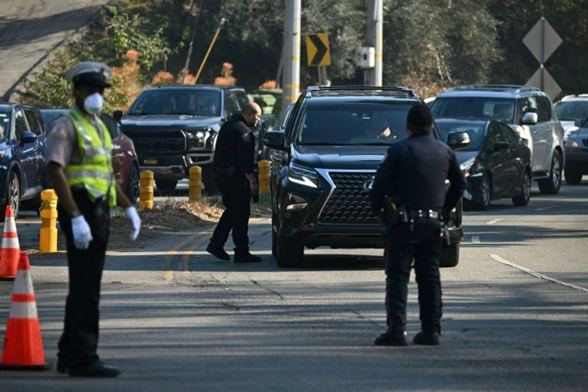 Survivors patrol as looters prey on fire-wrecked Los Angeles