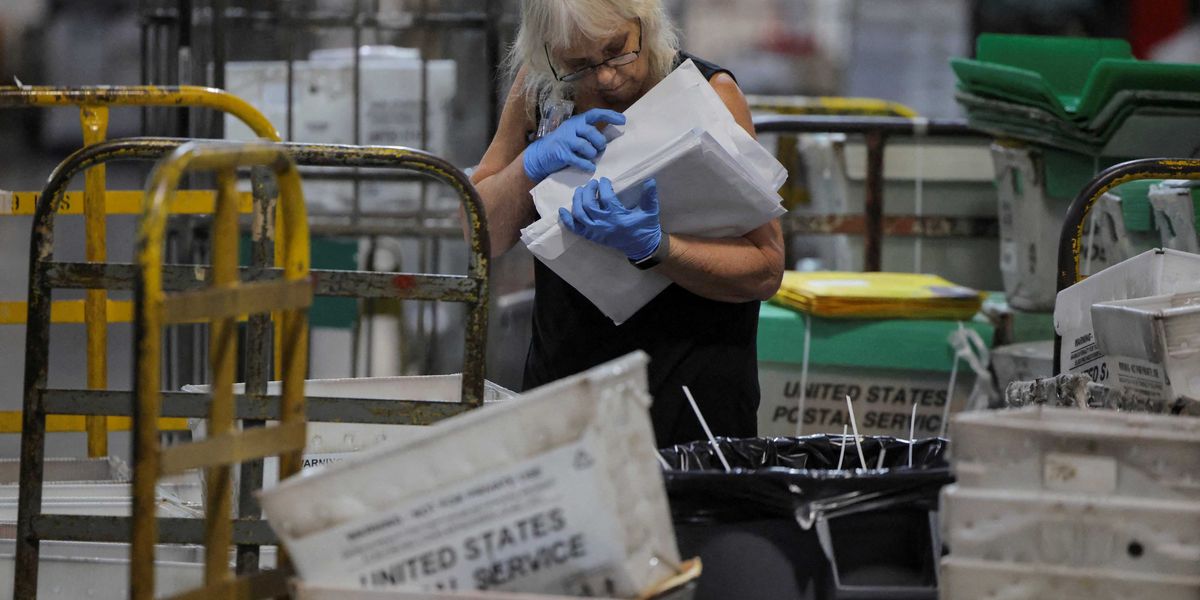 Fury as fourth postal worker dies at flagship USPS facility that has no phones