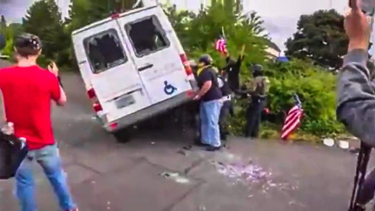 Video shows Proud Boys destroying and flipping wheelchair van in Portland