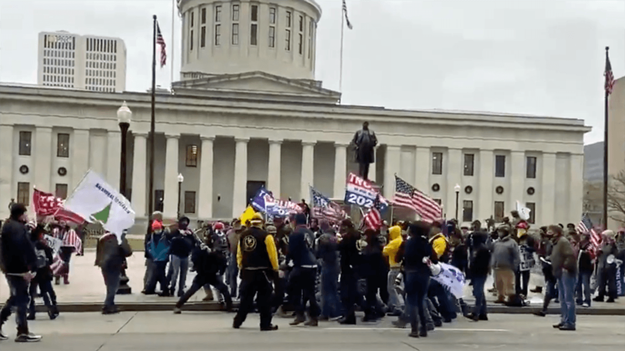WATCH: Trump supporters and Proud Boys beat man in front of the Ohio Statehouse