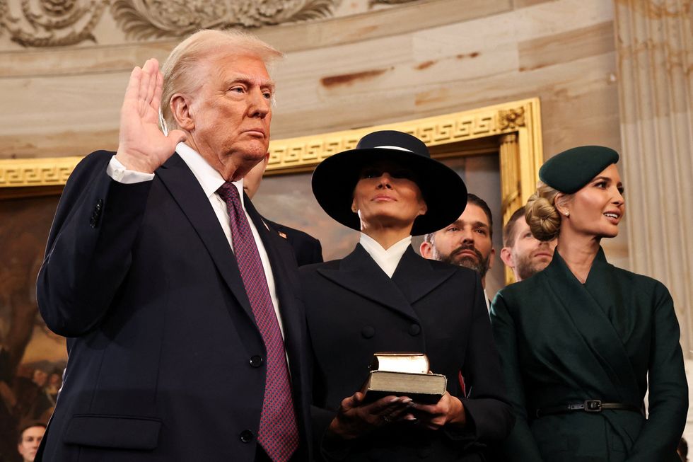 'Saved by God' Trump mocked for not placing hand on Bible during oath