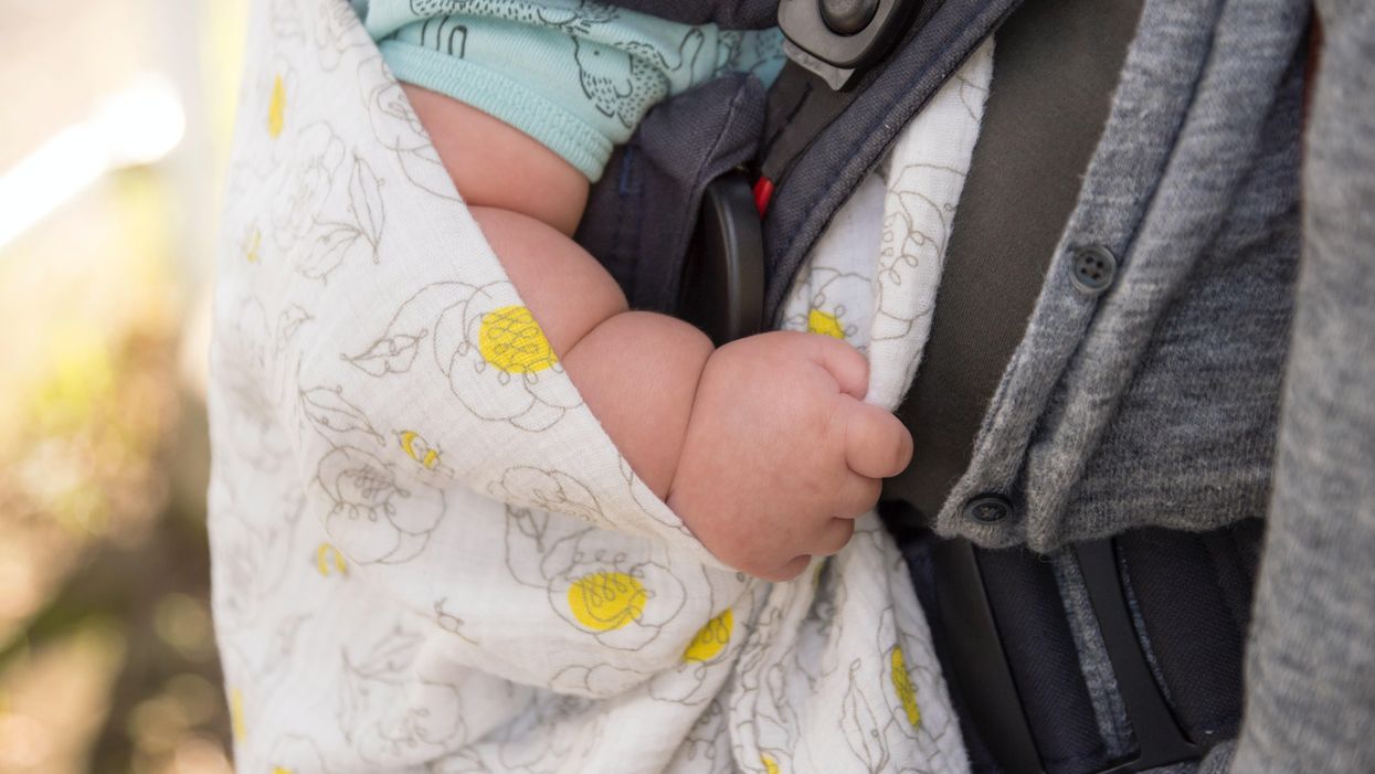 Infant dies after being left behind in hot car following arrest of father