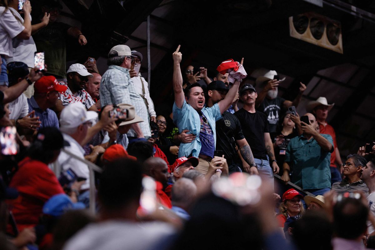 MAGA fan assaults Trump protester on his way out the door at Texas rally