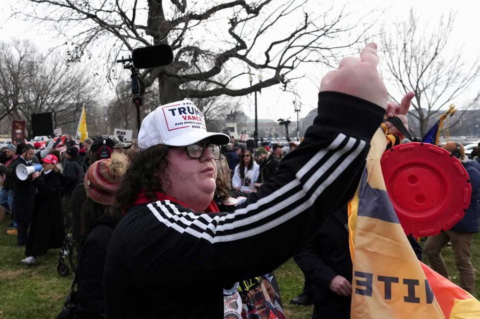 'Diseased animal!' Pardoned J6 rioters cuss and jeer at Capitol police during march