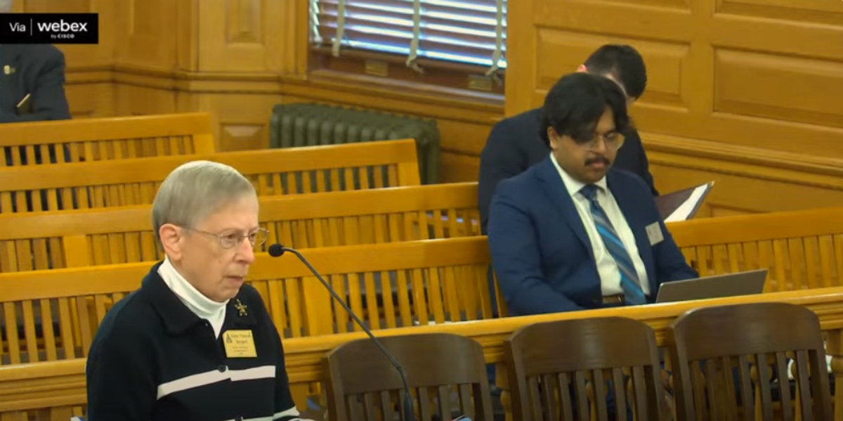 Lone nun stands before Kansas House to oppose immigration enforcement