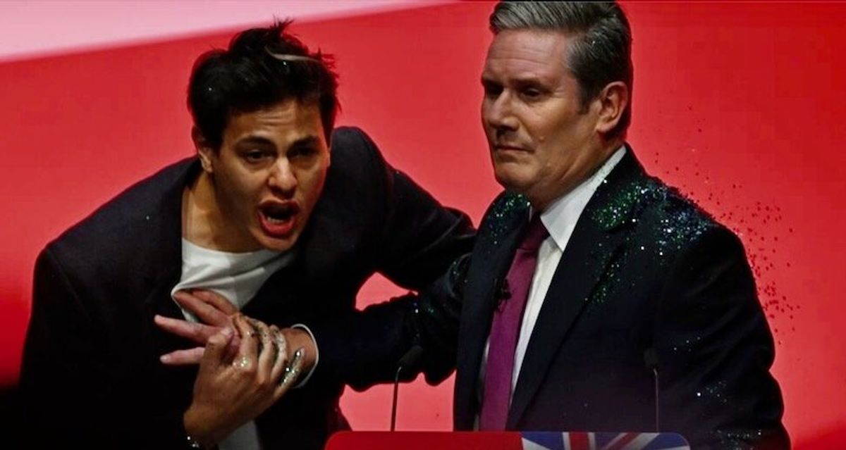 Heckler showers glitter on UK opposition leader before key speech