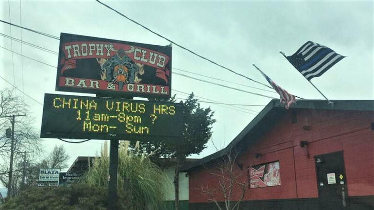Owner hurled racist abuse at man after he complained about bar's 'China virus' sign: report