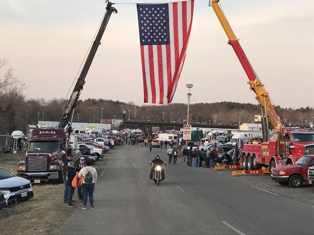 Camped outside DC, uneasy truckers paralyzed by paranoia vow to stay until demands met