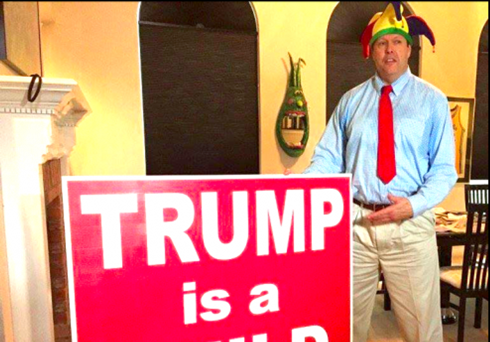 Travis County Republican Party chairman Robert Morrow with the sign he plans to protest with at Donald Trump's Austin rally (Facebook.com)