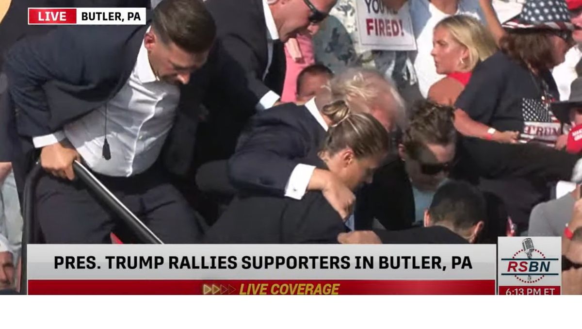 Bleeding Trump taken away from rally stage after being hit by loud projectiles