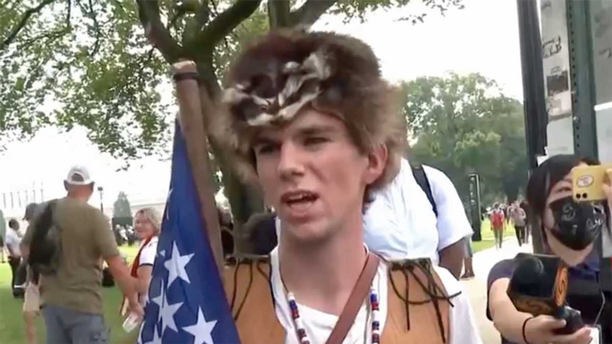 Trump supporter wearing dead animal refuses to believe Jan 6 was violent — even after CNN showed him video