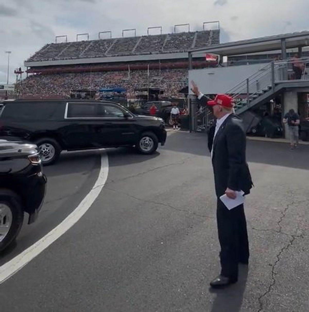 'Stage the moment': Trump accused of being 'caught waving at a non-existent audience'