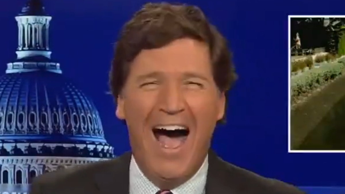 WATCH: Tucker Carlson bursts out in maniacal laughter while pushing racist conspiracy theory