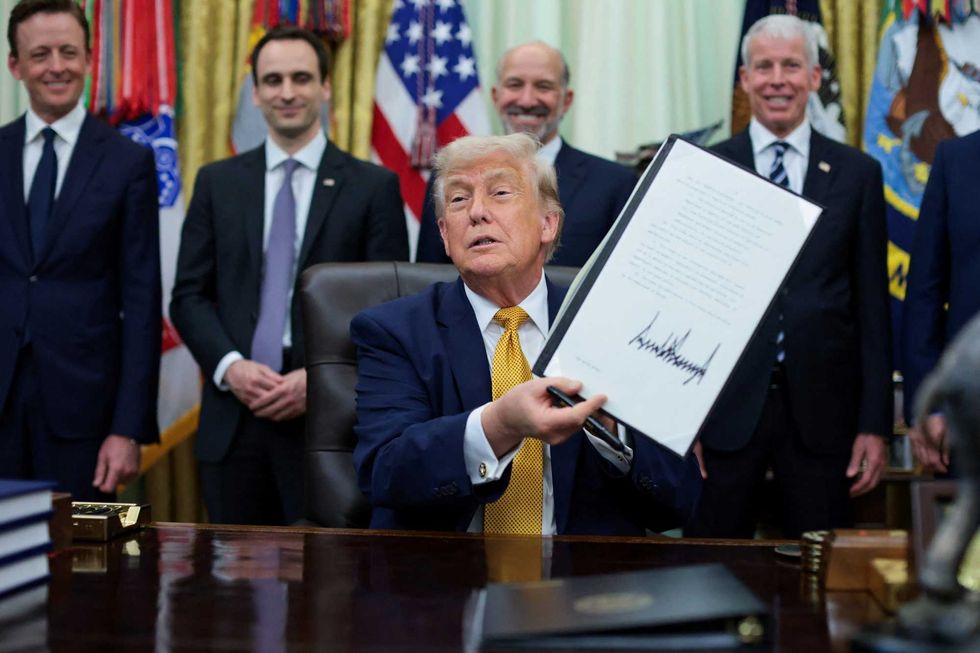 Confused Trump raises eyebrows as he stumbles through order-signing on 'crypto-graffey'