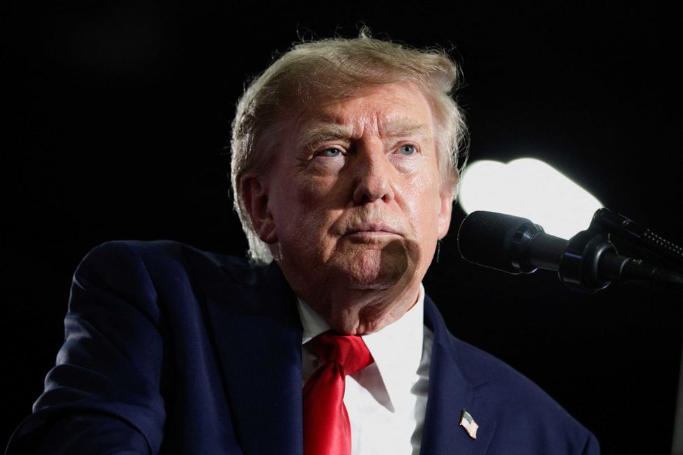 Hecklers stop Trump's speech cold as angry MAGA fan fires back with vulgar gesture