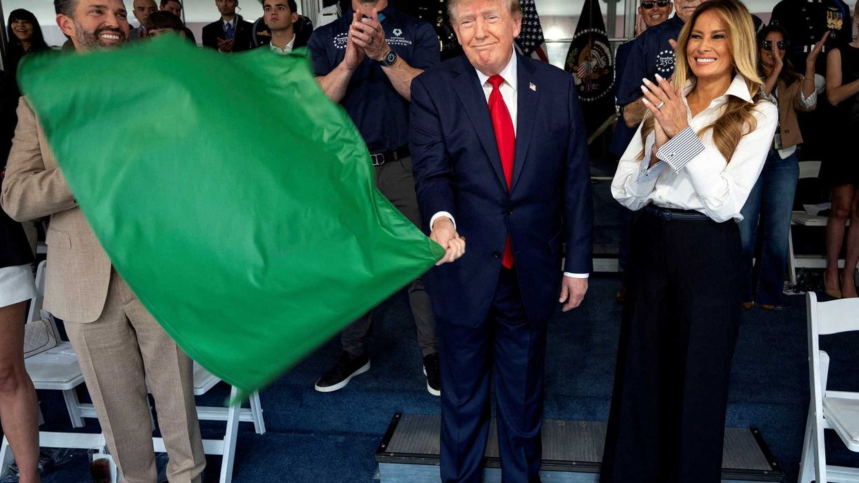 Jim Acosta Show chortles watching Trump manhandle Grand Prix flag: 'Shook the green out!'