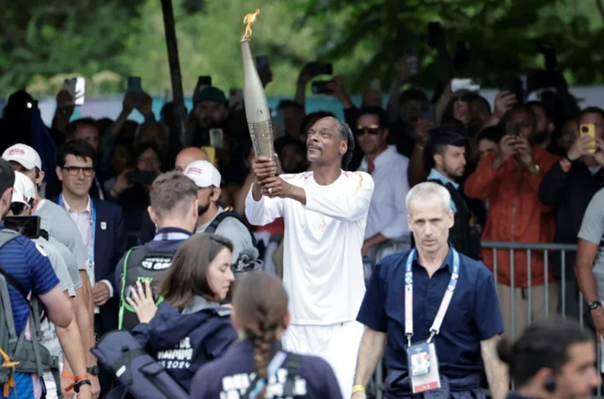 Snoop Dogg stars as flame sails into Paris for opening ceremony