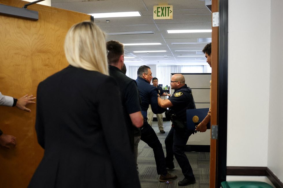 'Sickened my stomach': Lawmakers livid after senator 'dragged and handcuffed'