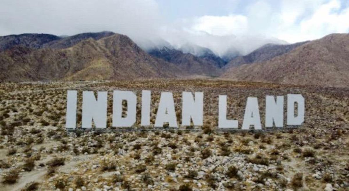 Vast 'Indian Land' sign draws visitors to Desert X art festival in the Coachella Valley