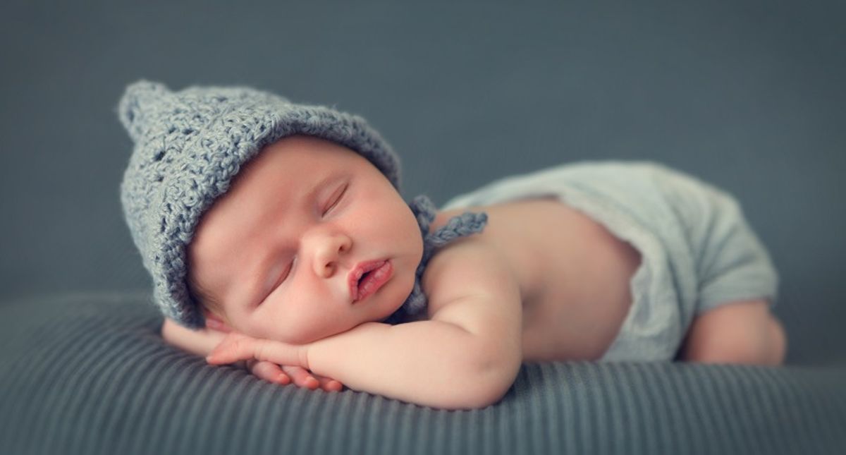 Why do humans have near-equal numbers of male and female babies, unlike many other animals