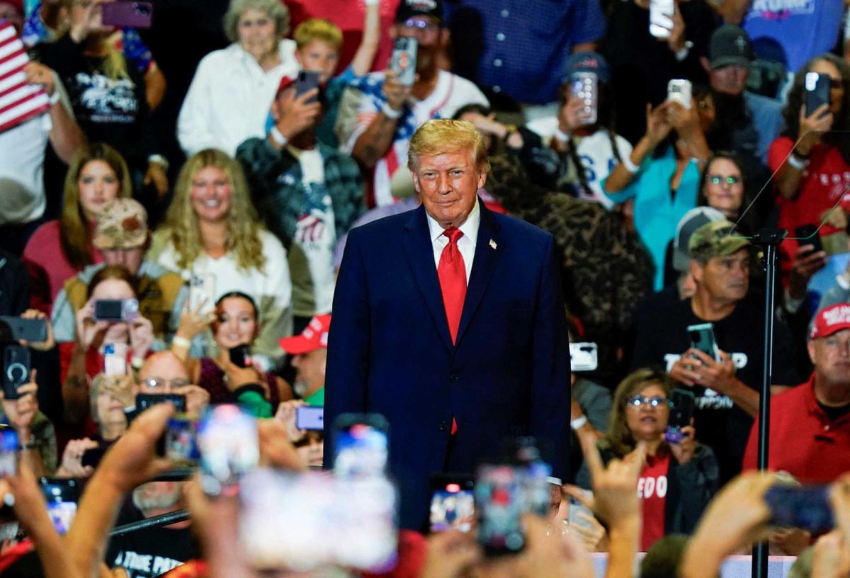 MAGA fan rushes back to Trump rally in hospital gown after having a seizure