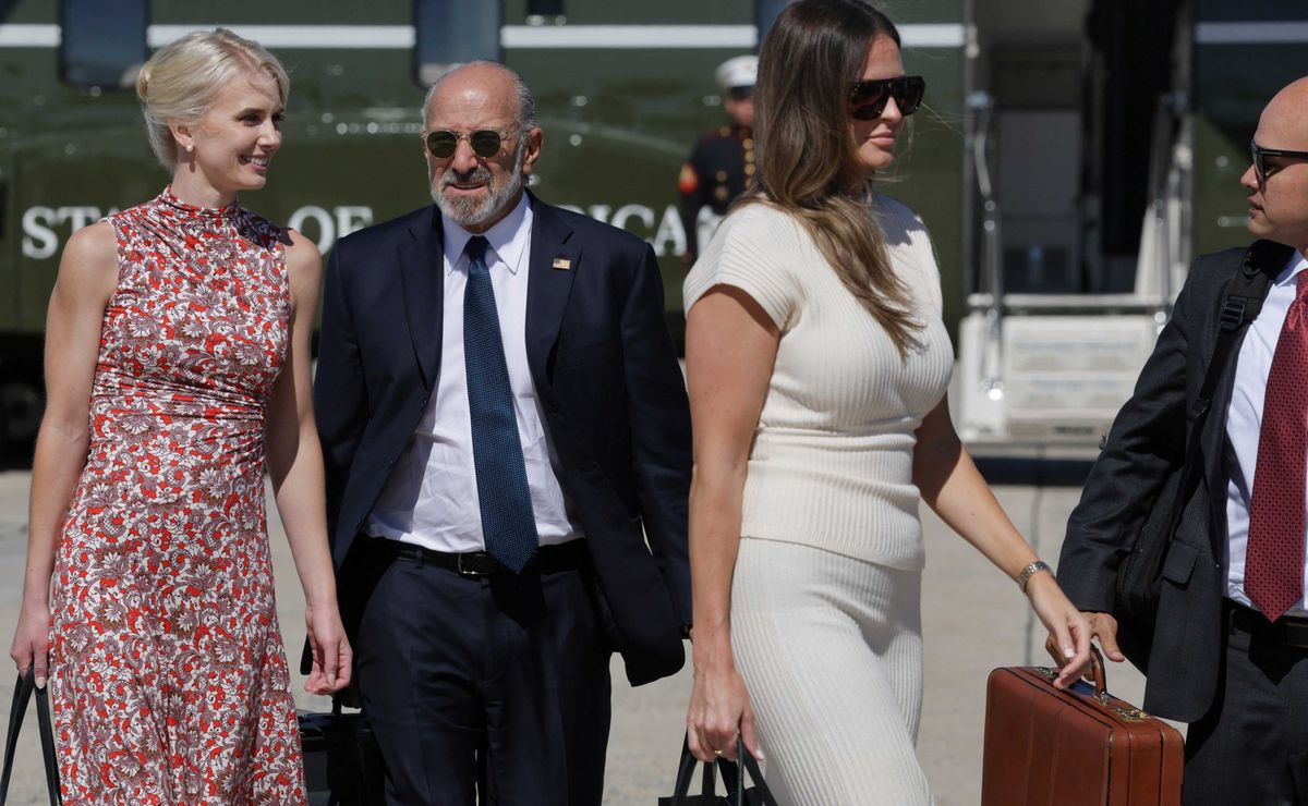 Trump gushes over 'beautiful' younger aide onstage as Natalie Harp looks on