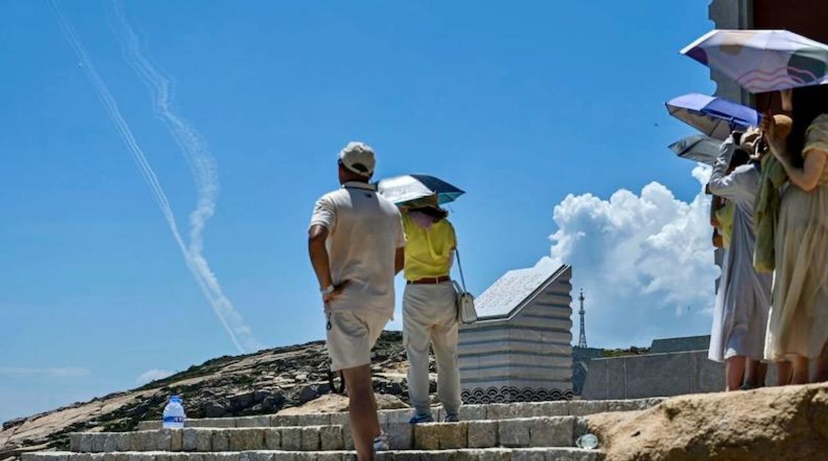 Bemused tourists granted front row seats to China's latest fire and fury