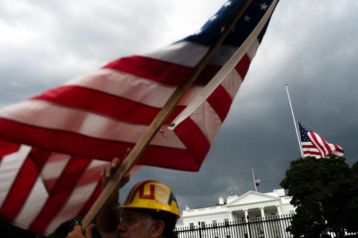White House Trump supporter waves flag