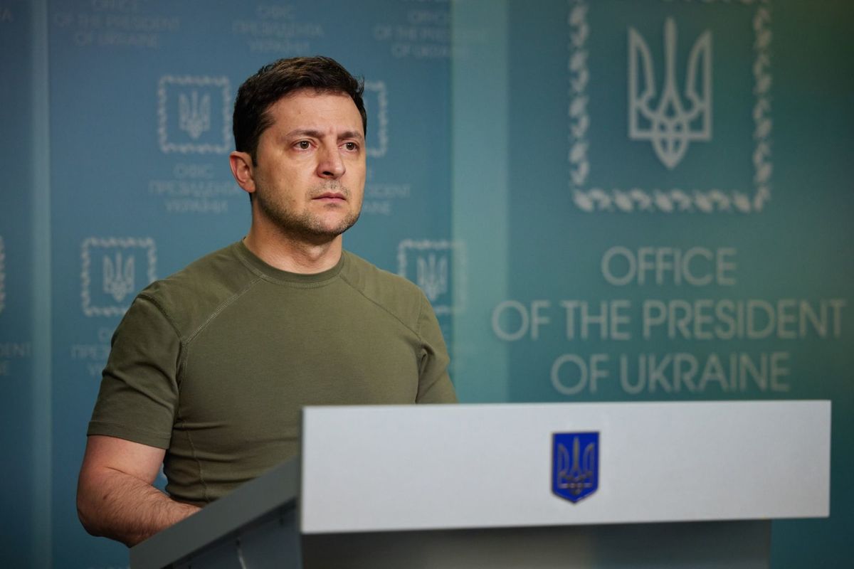 Anti-Russia activists change the street sign outside of the embassy to celebrate Zelensky